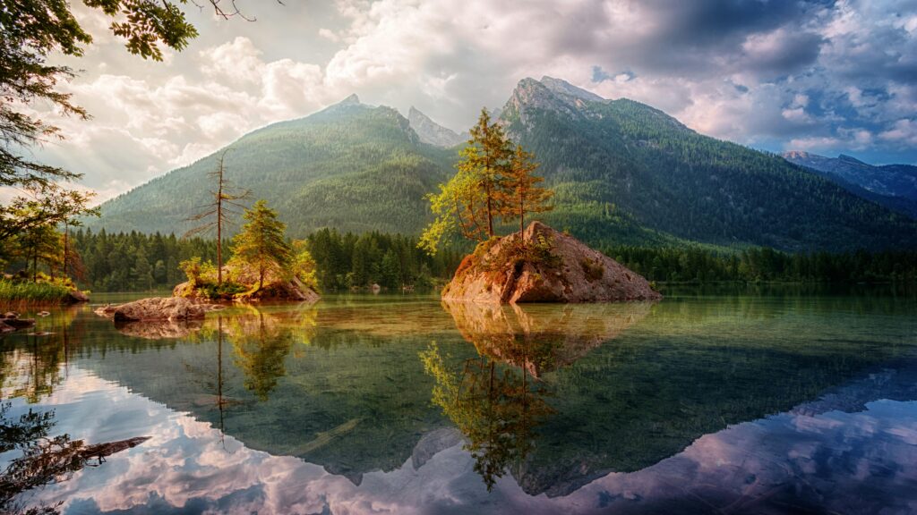 Beautiful alpine lake scene with mountain reflections in Germany during daylight.